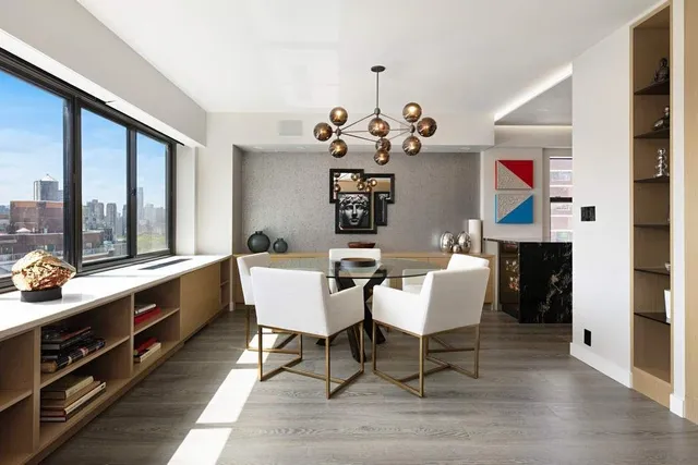 a very nice looking dining room with a large window