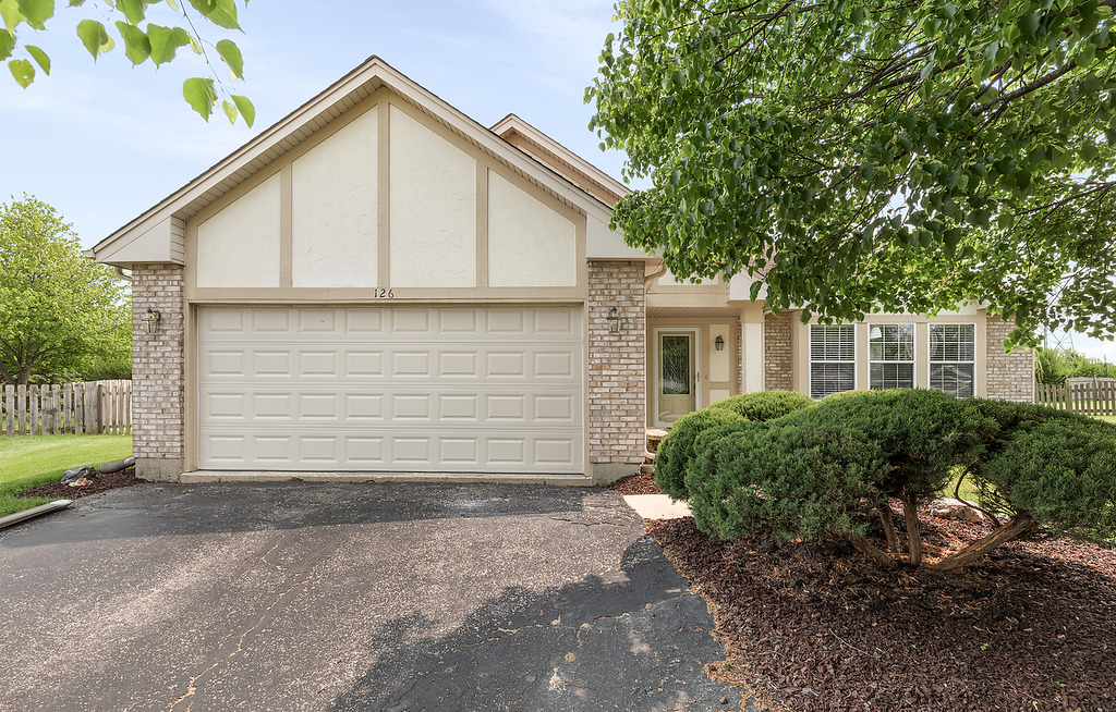 126 Dickens Trail Elgin, IL 60120 - Photo 1 of 23 a view of house with backyard and garden