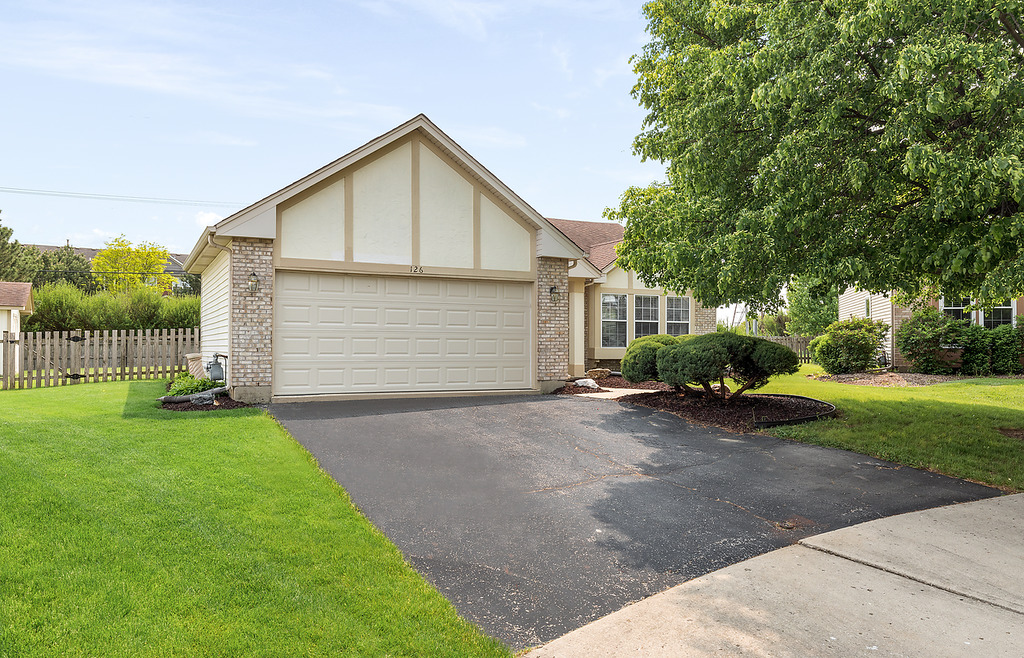 126 Dickens Trail Elgin, IL 60120 - Photo 2 of 23 a view of a house with backyard and garden
