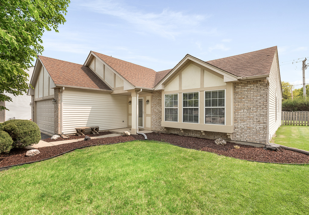 126 Dickens Trail Elgin, IL 60120 - Photo 3 of 23 a view of front of a house with a yard