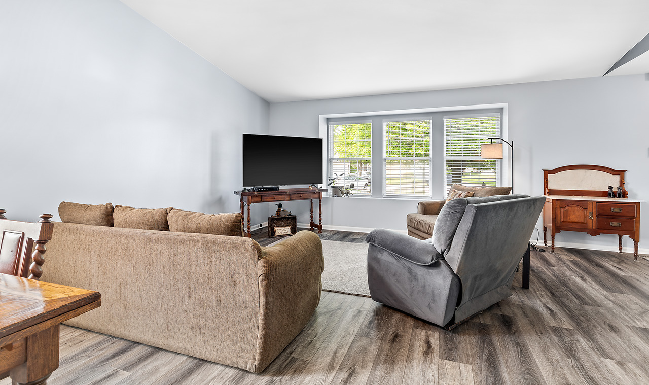 126 Dickens Trail Elgin, IL 60120 - Photo 6 of 23 a living room with furniture and a flat screen tv