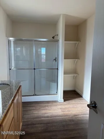 a view of an empty room with a window