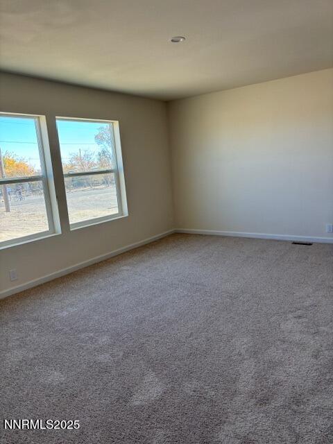 3599 Ardmore Street Silver Springs, NV 89429 - Photo 17 of 29 an empty room with a window