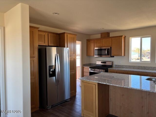 3599 Ardmore Street Silver Springs, NV 89429 - Photo 2 of 29 a kitchen with stainless steel appliances granite countertop a refrigerator a stove top oven a sink dishwasher and wooden floor