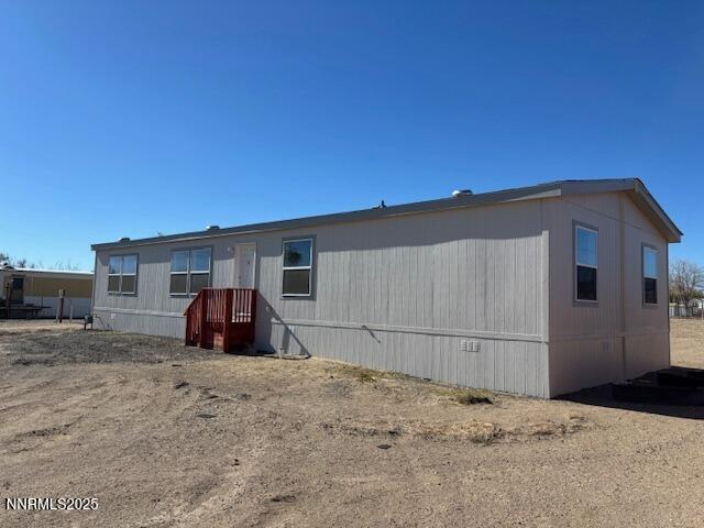 3599 Ardmore Street Silver Springs, NV 89429 - Photo 21 of 29 a view of a house with a yard