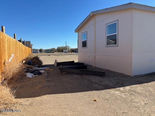 3599 Ardmore Street Silver Springs, NV 89429 - Photo 27 of 29 a view of a house with backyard and sitting area