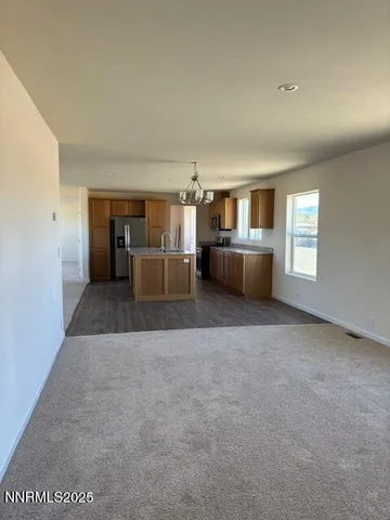 a living room with a couch and a large window