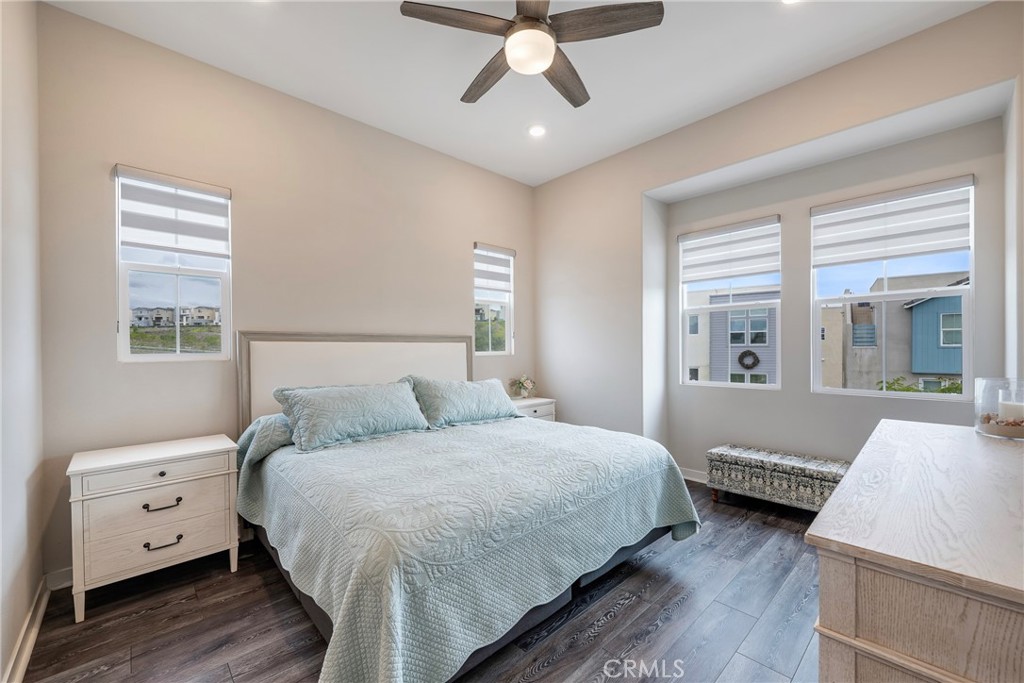 6 Pony Court Rancho Mission Viejo, CA 92694 - Photo 14 of 35 a bedroom with a bed and a chandelier