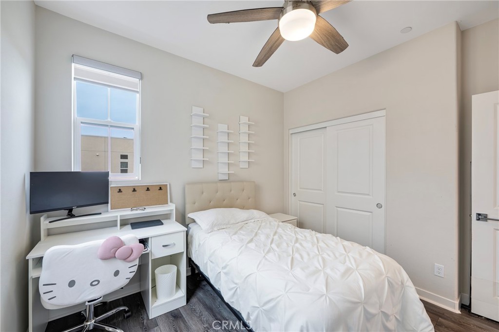 6 Pony Court Rancho Mission Viejo, CA 92694 - Photo 19 of 35 a bedroom with a bed and a chandelier