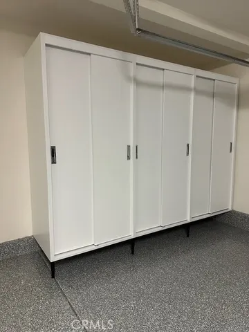 a view of a closet area with hallway