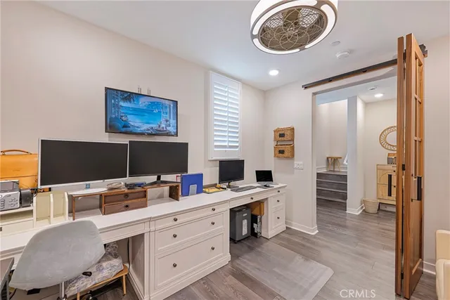 a view of a workspace with furniture