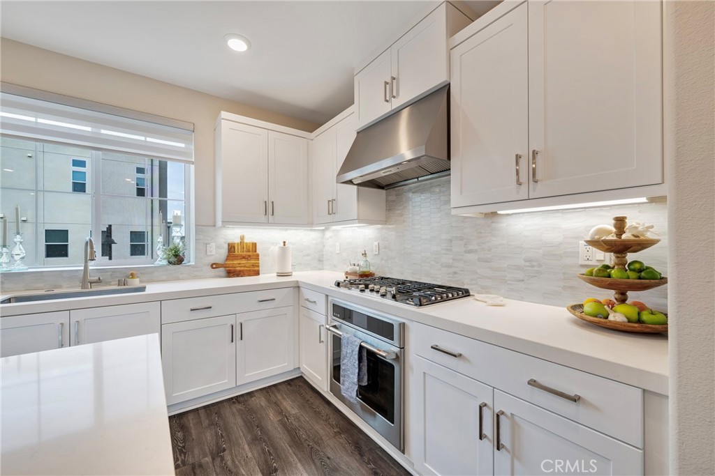 6 Pony Court Rancho Mission Viejo, CA 92694 - Photo 9 of 35 a kitchen with stainless steel appliances granite countertop a sink a stove and cabinets