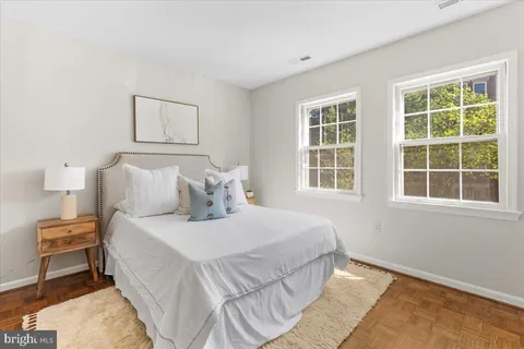 a bedroom with bed and a window