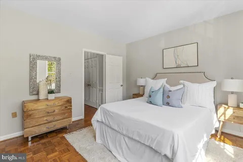 a bedroom with bed and window