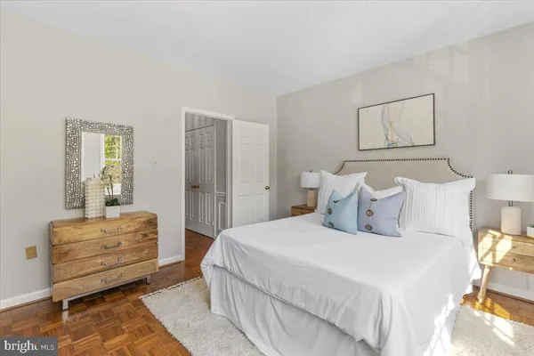 a bedroom with bed and window