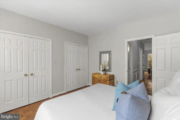 a bedroom with a bed and a closet