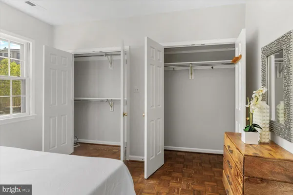 a bed room with a bed and a window