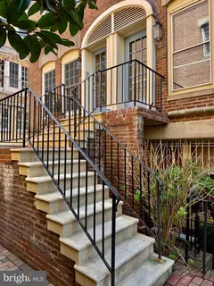 a view of a balcony with staircase