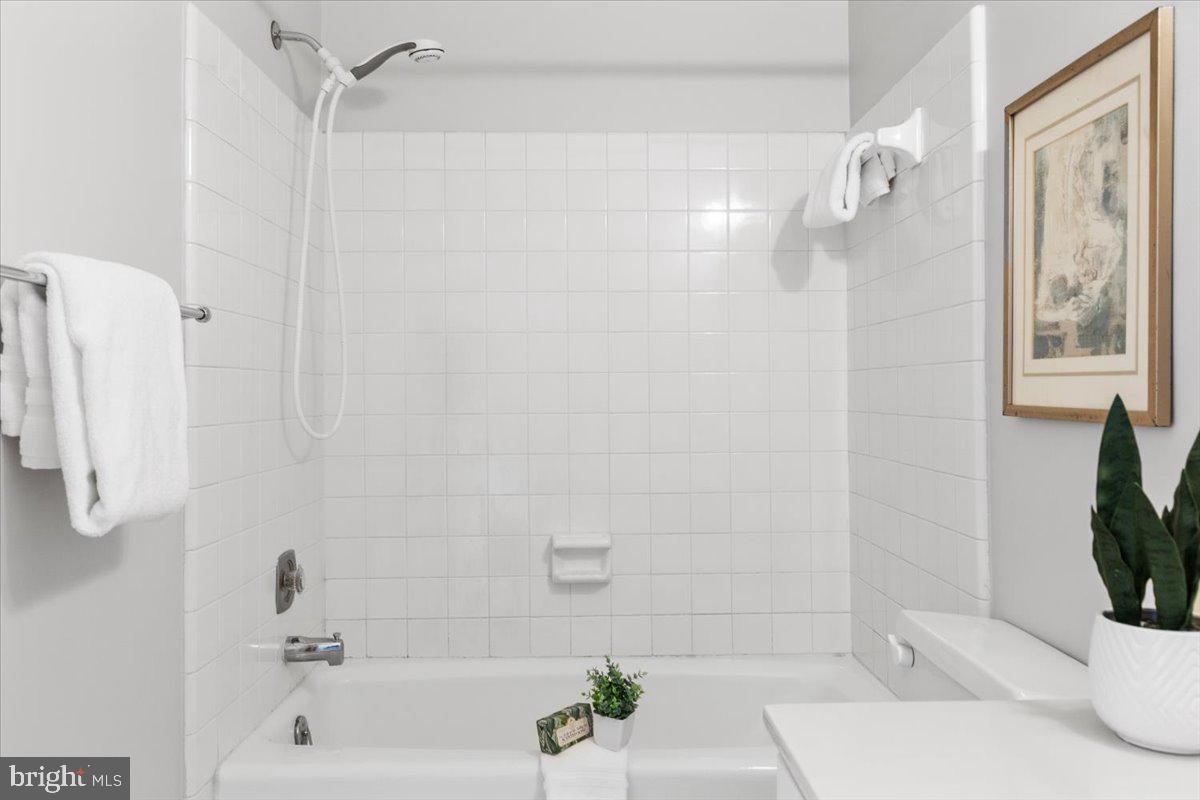 208 Justice Court Northeast, Unit 44 Washington, DC 20002 - Photo 21 of 26 a bathroom with a bathtub and a shower
