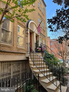 a view of a house with a iron gate