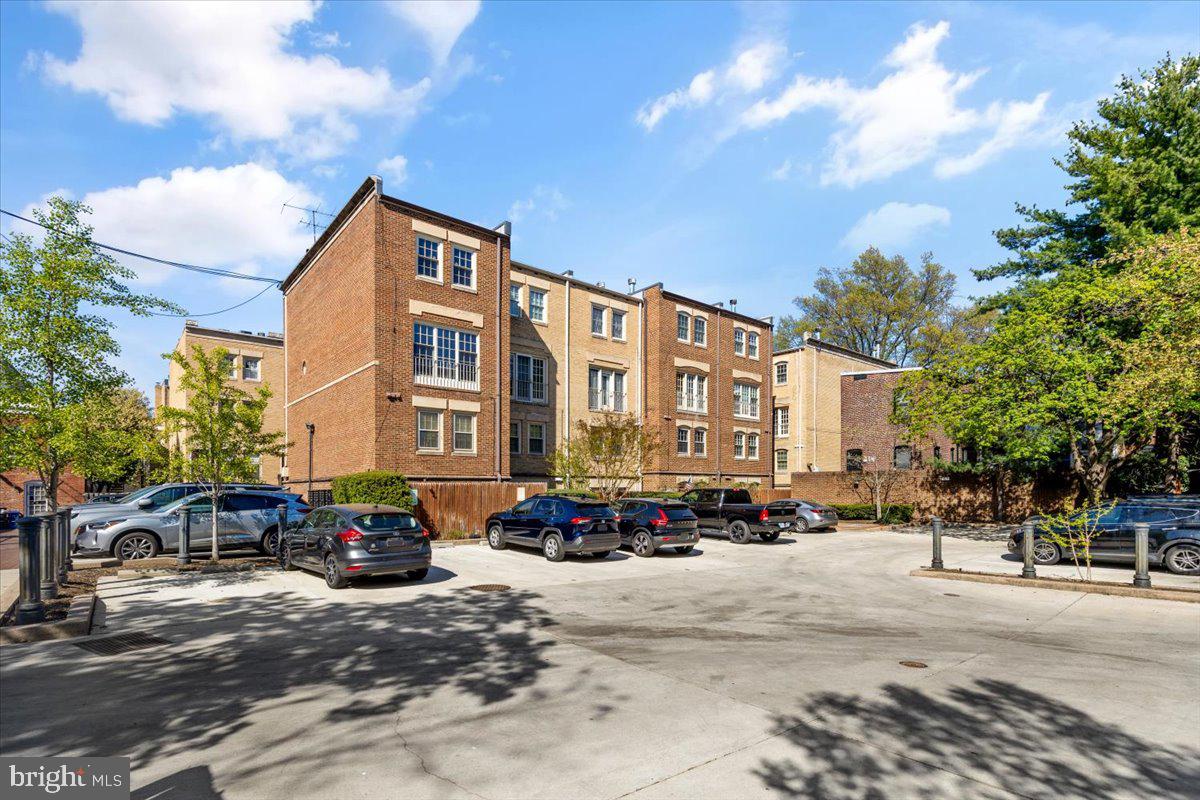 208 Justice Court Northeast, Unit 44 Washington, DC 20002 - Photo 26 of 26 a building with car parked in front of it