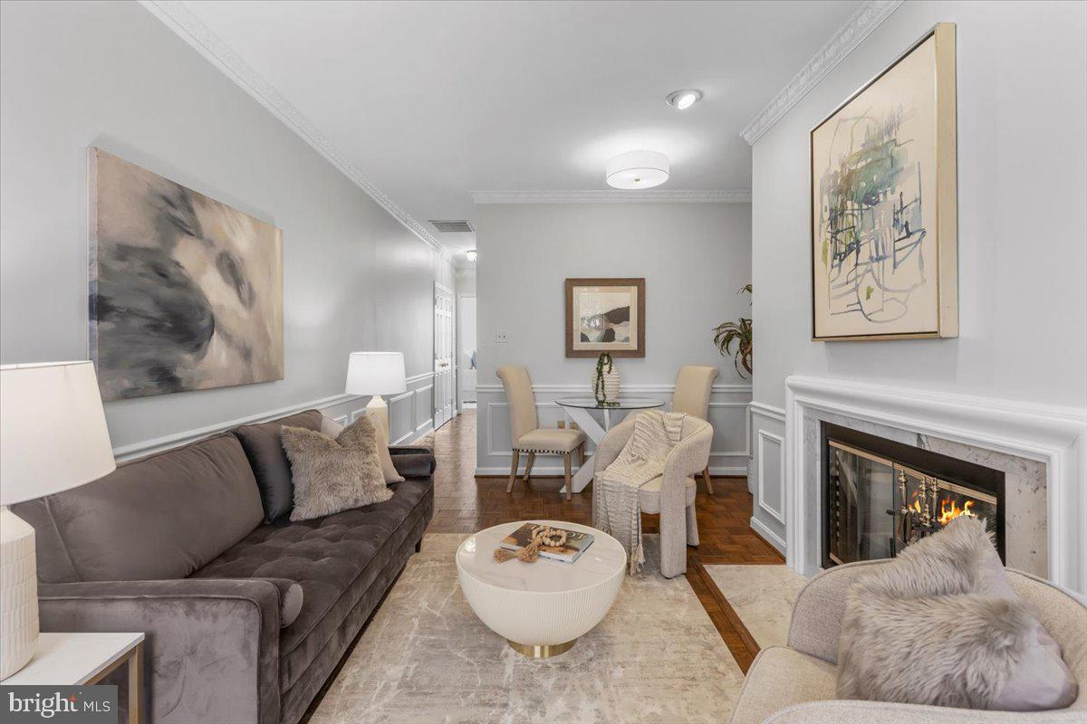 208 Justice Court Northeast, Unit 44 Washington, DC 20002 - Photo 5 of 26 a living room with furniture and a fireplace