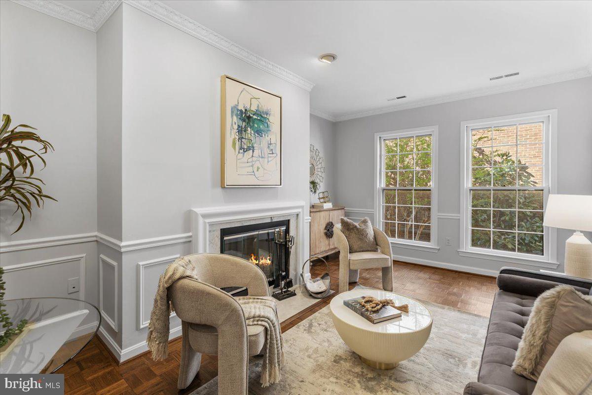208 Justice Court Northeast, Unit 44 Washington, DC 20002 - Photo 7 of 26 a living room with furniture and a fireplace