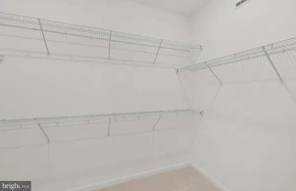 a view of a bathtub in closet