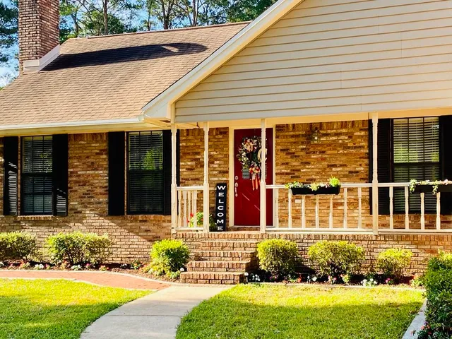 a front view of a house with a yard