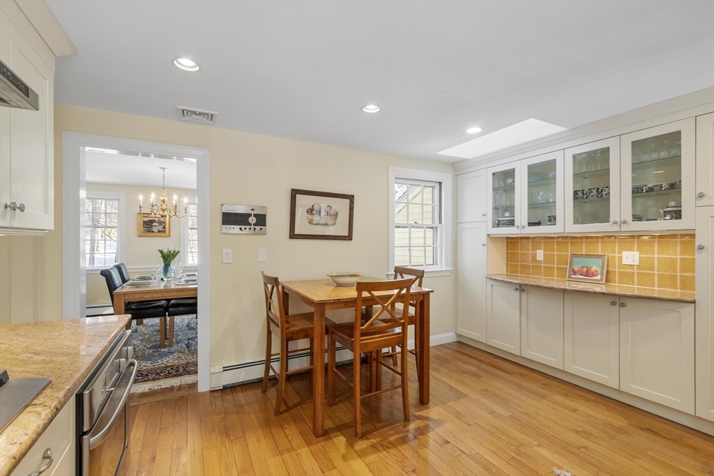 265 College Road Concord, MA 01742 - Photo 14 of 42 a dining room with furniture and wooden floor