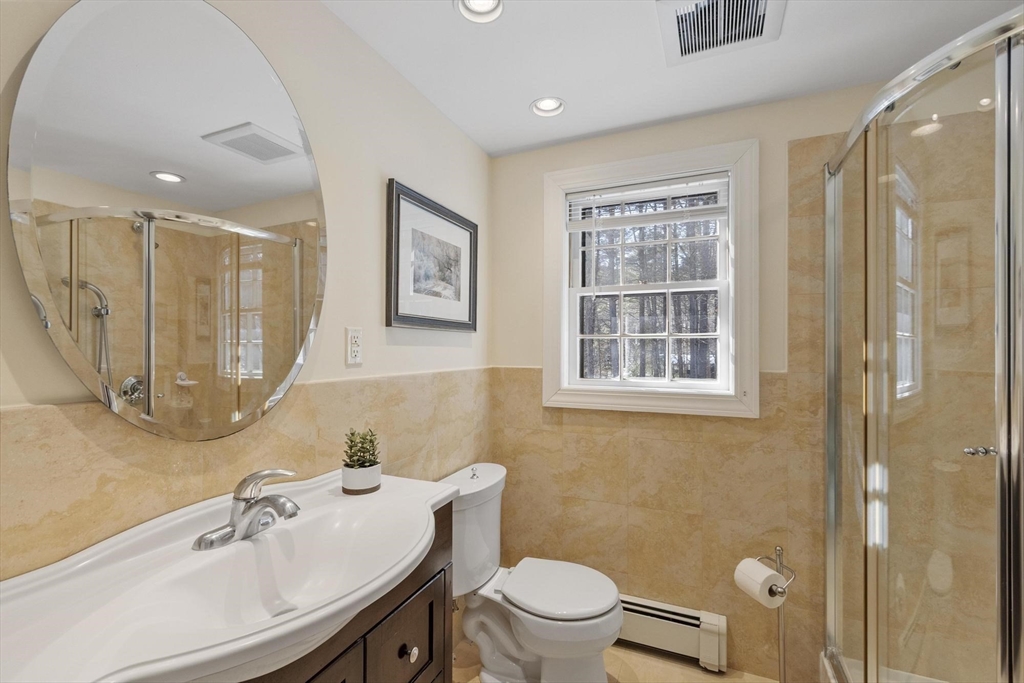 265 College Road Concord, MA 01742 - Photo 24 of 42 a bathroom with a sink a toilet and shower