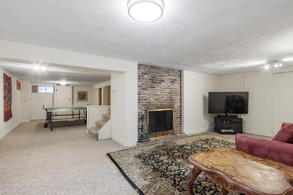 265 College Road Concord, MA 01742 - Photo 34 of 42 a living room with furniture and a flat screen tv