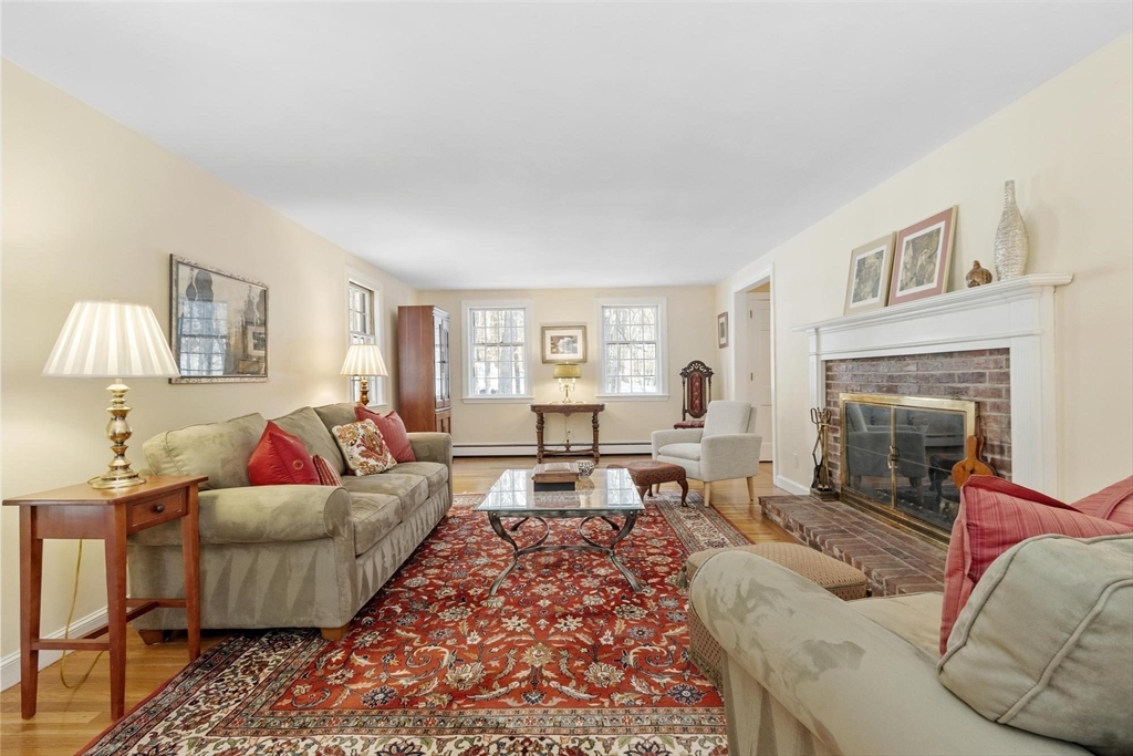 265 College Road Concord, MA 01742 - Photo 6 of 42 a living room with furniture and a fireplace