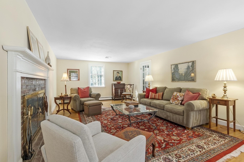 265 College Road Concord, MA 01742 - Photo 7 of 42 a living room with furniture and a fireplace