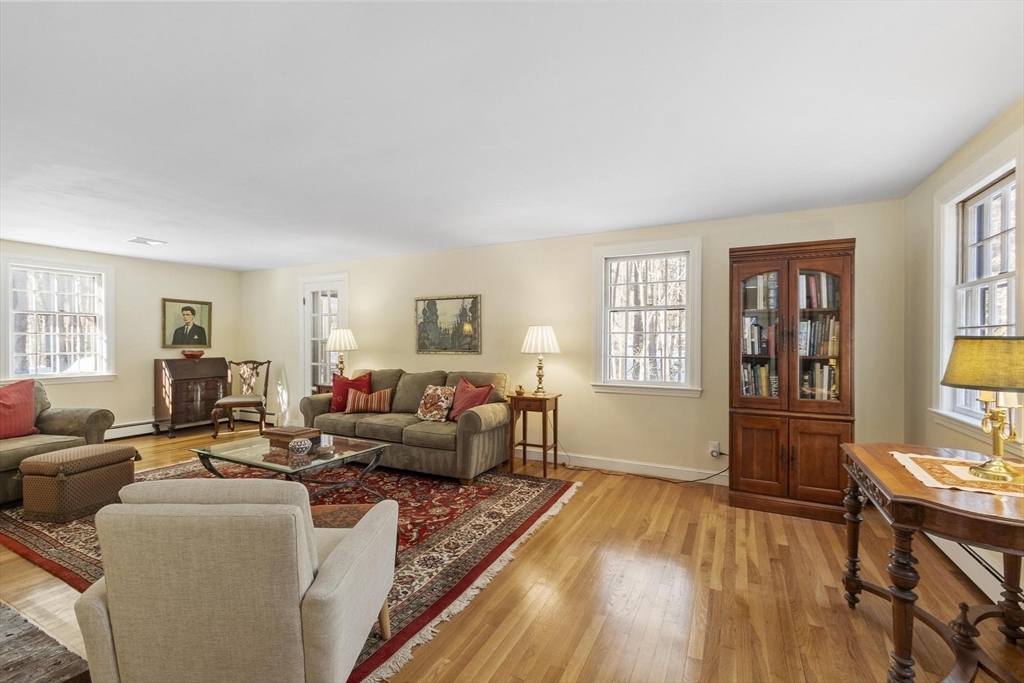 265 College Road Concord, MA 01742 - Photo 8 of 42 a living room with furniture and a wooden floor