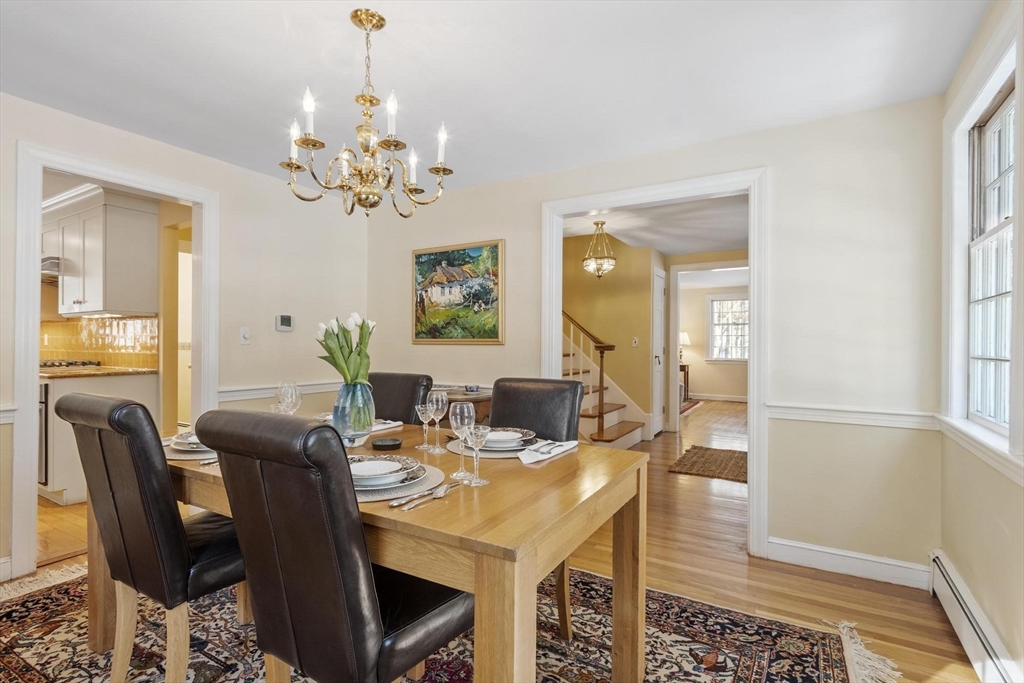 265 College Road Concord, MA 01742 - Photo 9 of 42 a view of a dining room with furniture and chandelier