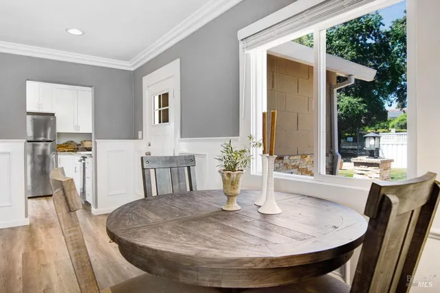 a dining room with table and chairs