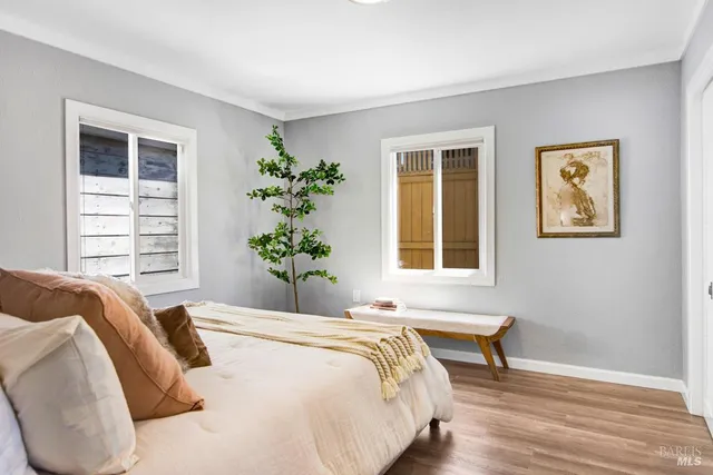 a spacious bedroom with a bed and a window