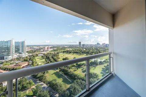 a view of a city skyline from a balcony