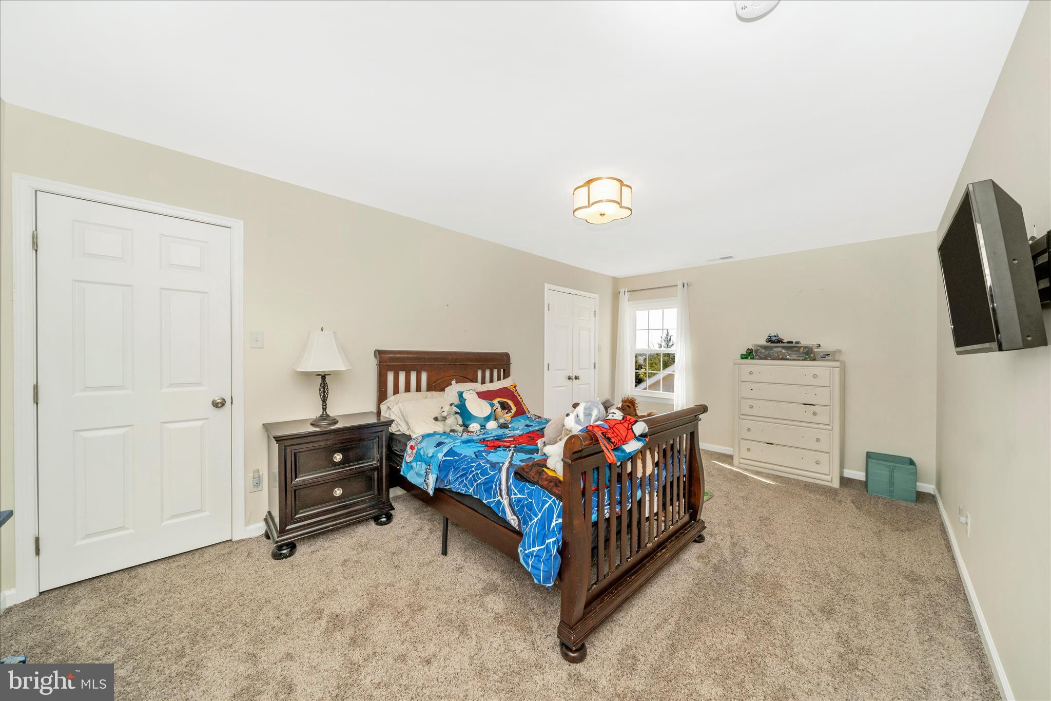 8730 Mapleville Road Mount Airy, MD 21771 - Photo 30 of 65 a living room with furniture and a flat screen tv