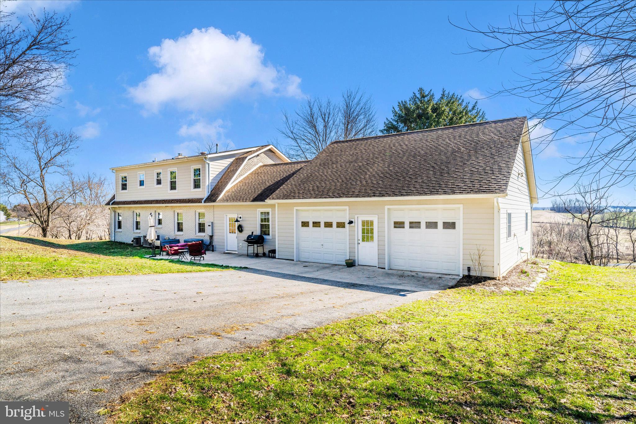 8730 Mapleville Road Mount Airy, MD 21771 - Photo 43 of 65 a view of a house with a yard and sitting area