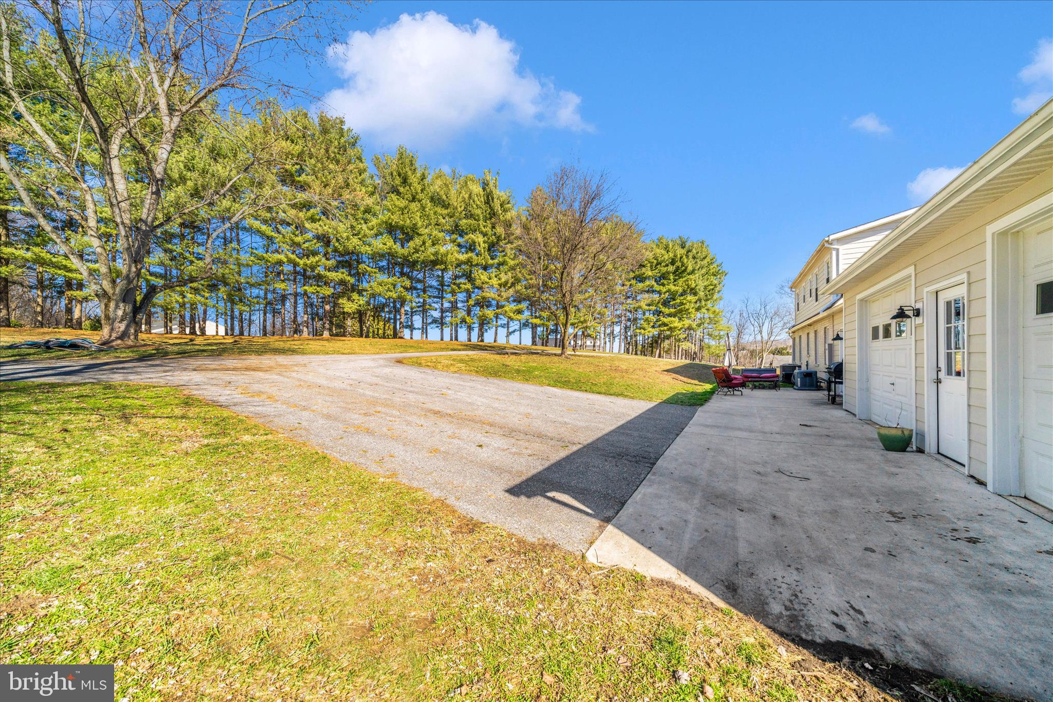 8730 Mapleville Road Mount Airy, MD 21771 - Photo 49 of 65 a view of an swimming pool with an outdoor space and seating area
