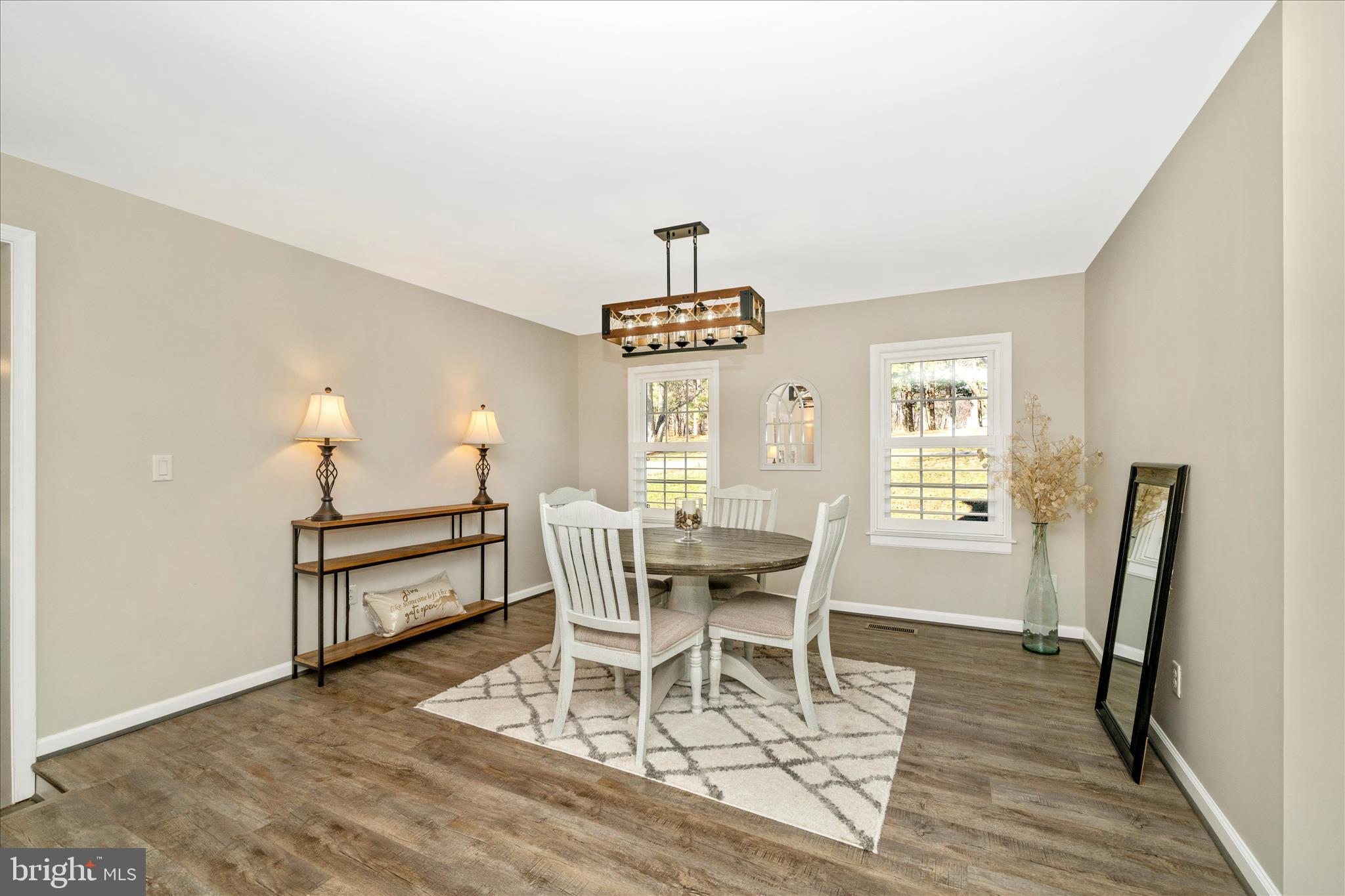 8730 Mapleville Road Mount Airy, MD 21771 - Photo 8 of 65 a view of a dining room with furniture and wooden floor