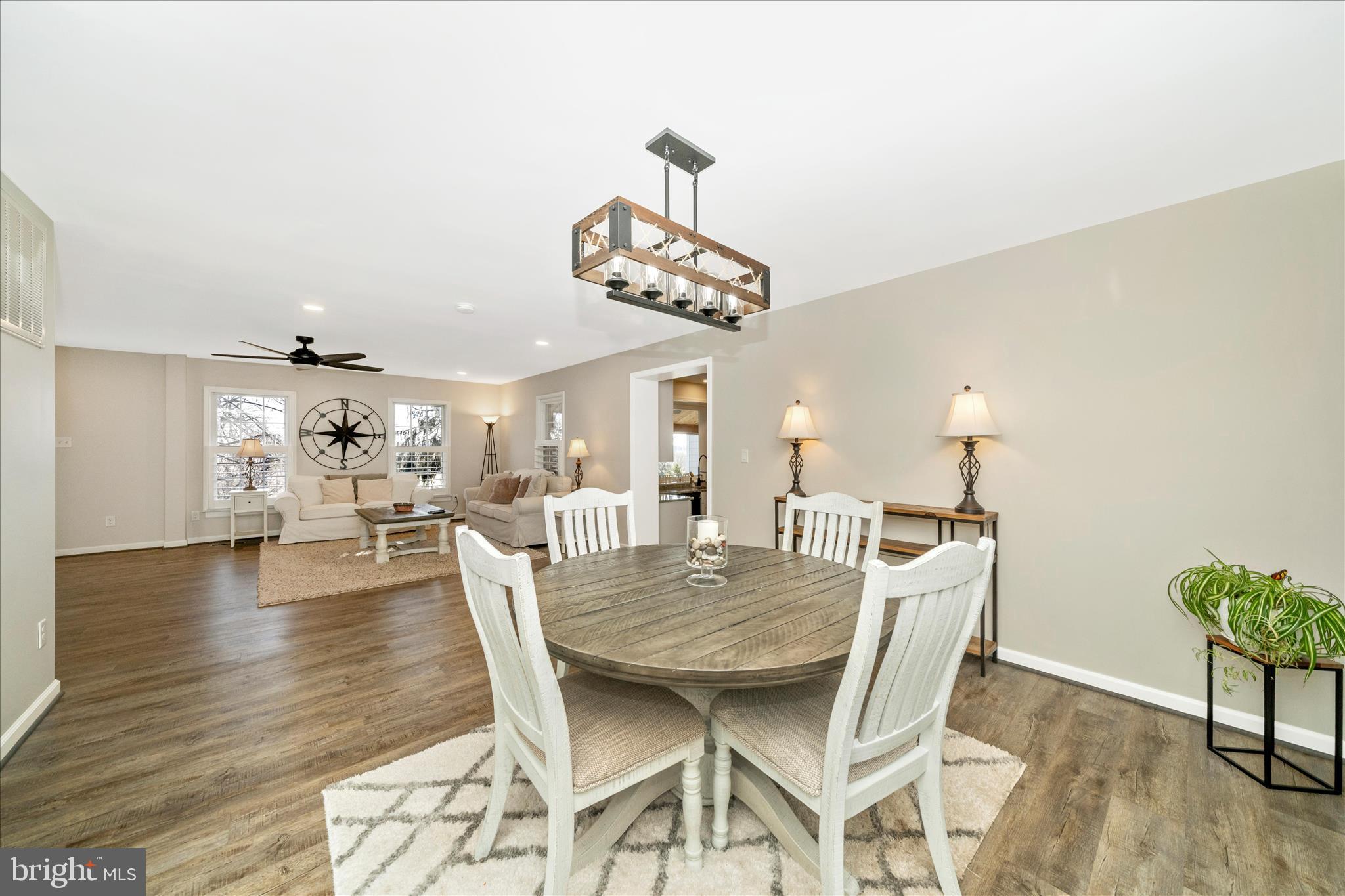 8730 Mapleville Road Mount Airy, MD 21771 - Photo 10 of 65 a view of a dining room with furniture wooden floor and chandelier