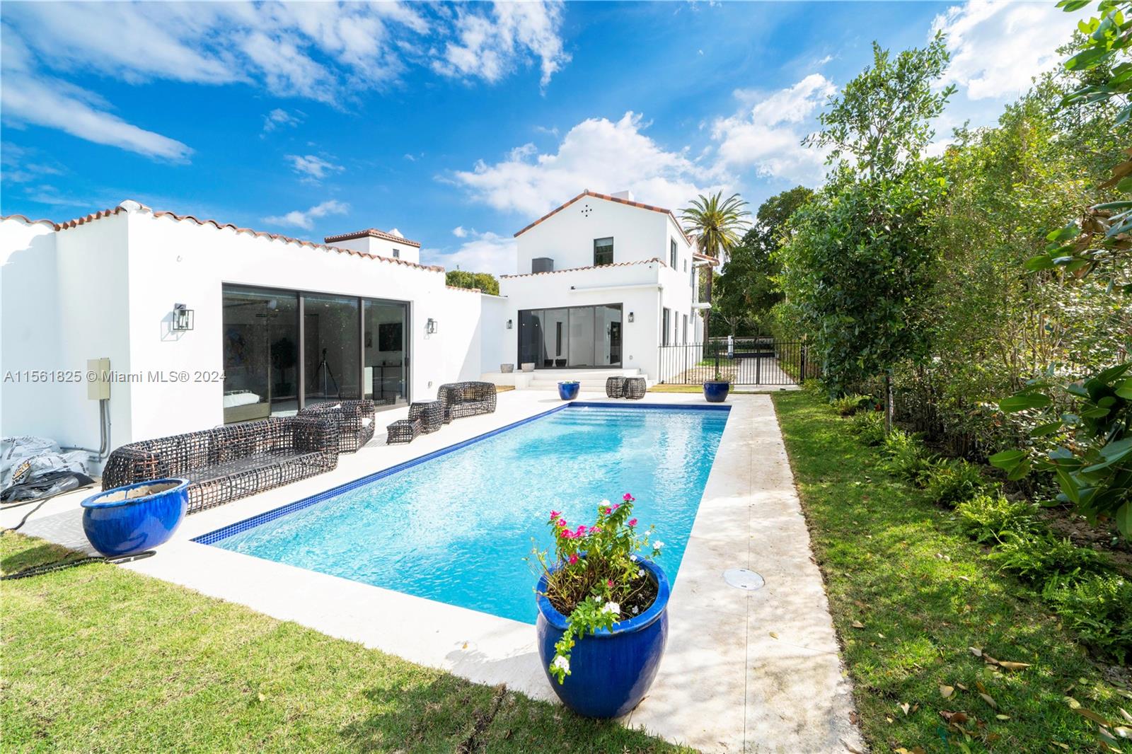 5334 Pine Tree Drive Miami Beach, FL 33140 - Photo 1 of 42 a view of a house with a swimming pool