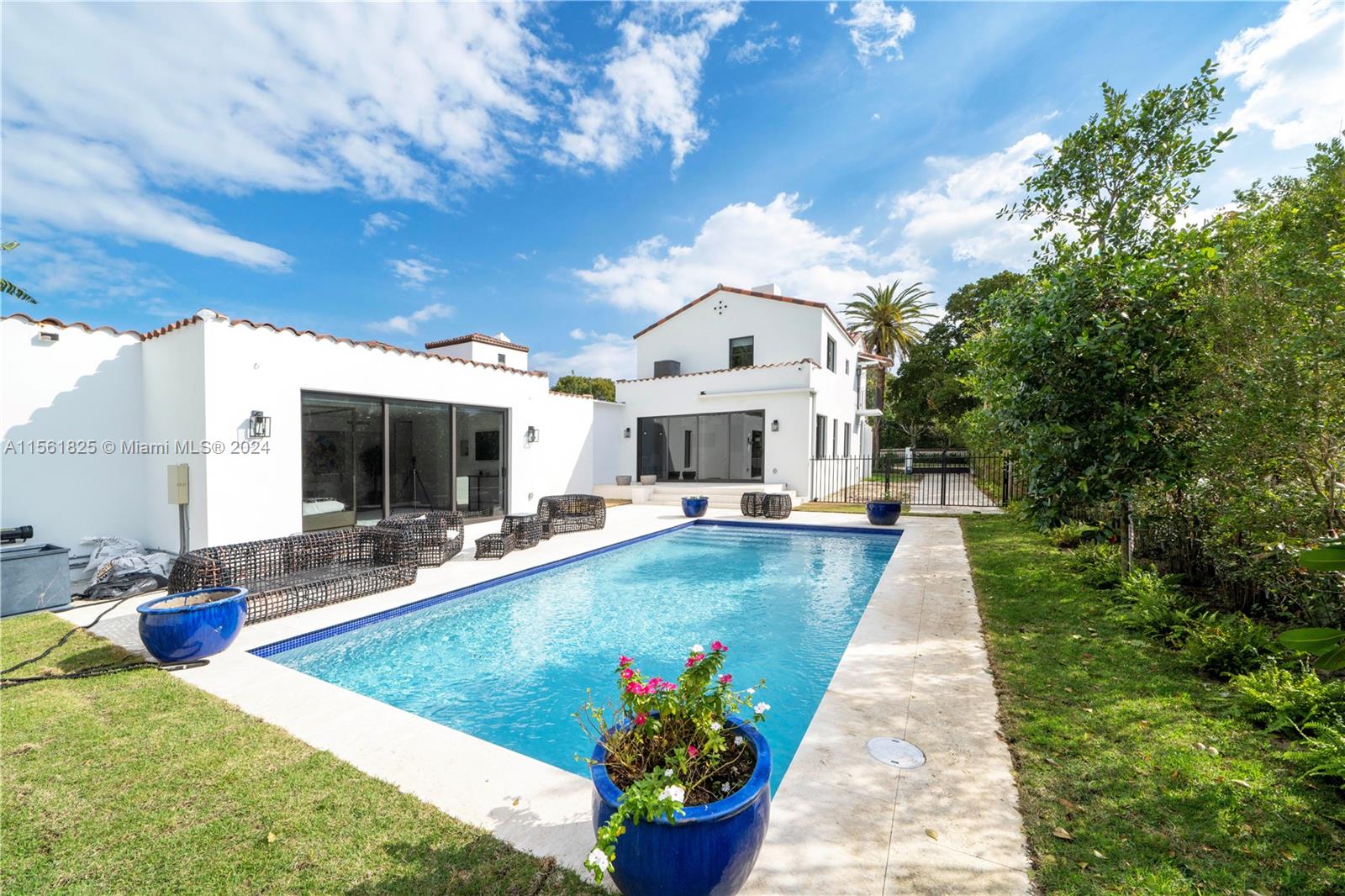 5334 Pine Tree Drive Miami Beach, FL 33140 - Photo 20 of 42 a view of a house with sitting area and a swimming pool