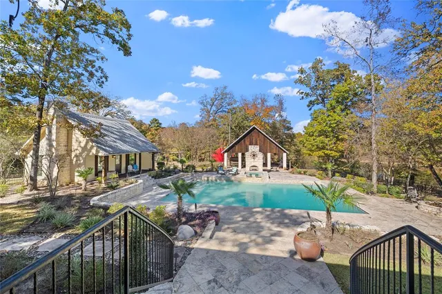 a view of a backyard with sitting area