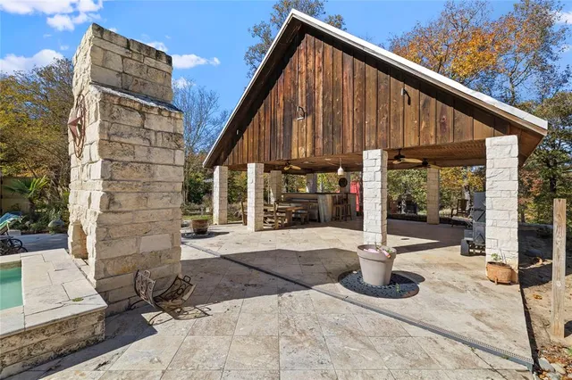 a kitchen with large windows