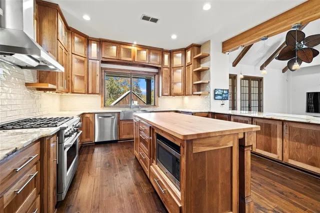 a kitchen with a stove and a sink
