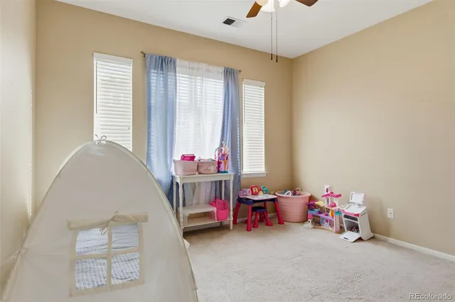 a bed room with a bed and a window